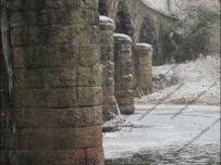 Ice forms around a bridge