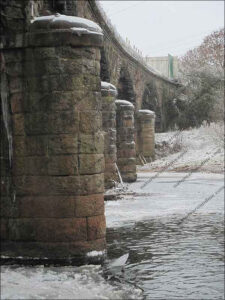 Ice forms around a bridge